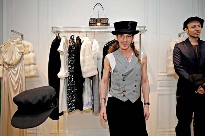 Dior suspends designer Galliano after cafe spat